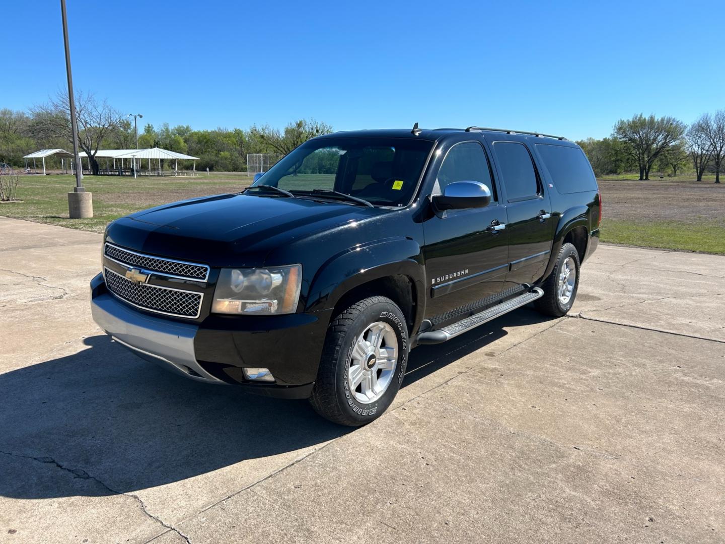 2007 BLACK /BLACK Chevrolet Suburban LS 1500 4WD (3GNFK16377G) with an 5.3L V8 OHV 16V FFV engine, 4-Speed Automatic Overdrive transmission, located at 17760 Hwy 62, Morris, OK, 74445, (918) 733-4887, 35.609104, -95.877060 - 2007 CHEVROLET SUBURBAN HAS 5.3L V8 ENGINE. THIS SUV FEATURES KEYLESS REMOTE ENTRY, POWER SEATS, POWER LOCKS, POWER WINDOWS, POWER WINDOWS, POWER ADJUSTABLE FOOT PEDAL, AMFM STEREO, XM RADIO, AUX PORT, NAVIGATION, BACKUP CAMERA, MULIT-FUNCTION STEERING WHEEL CONTROLS, CRUISE CONTROL, DUAL CLIMATE CO - Photo#0